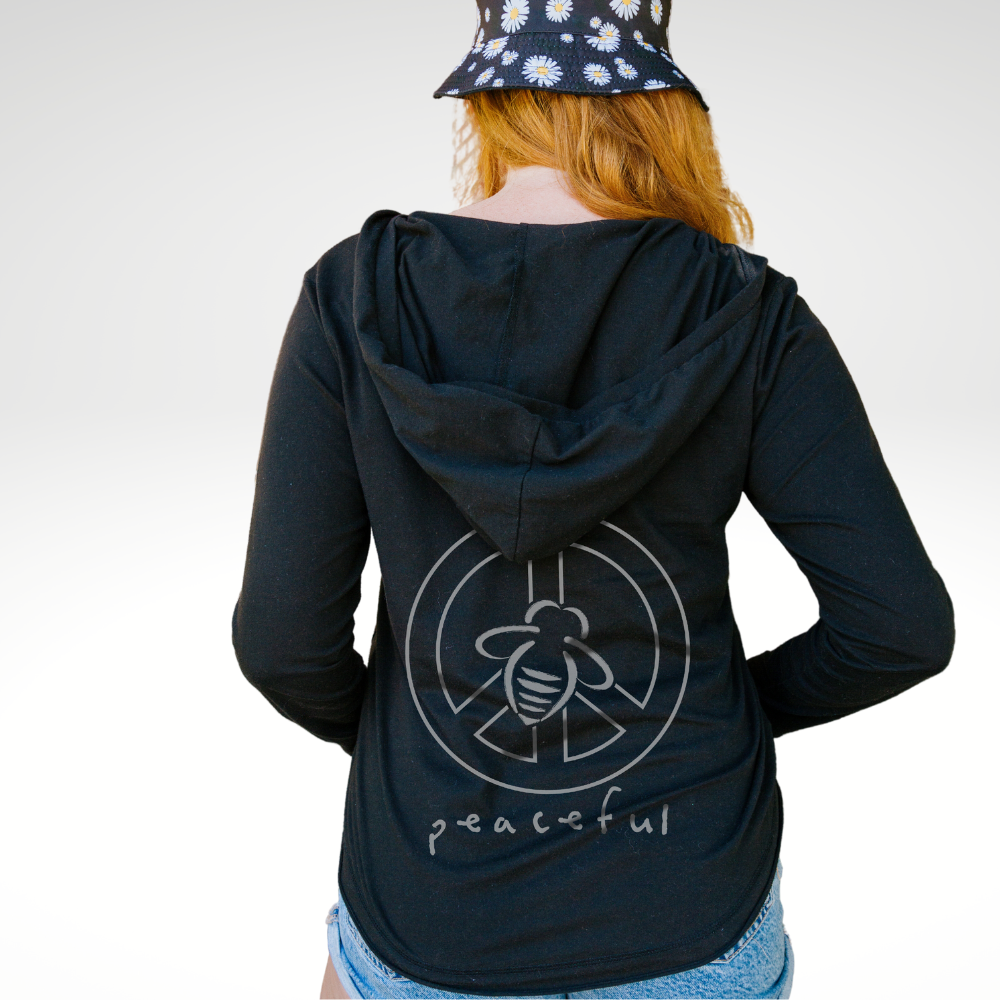 Bee Peaceful Beach Hoodie - BeeAttitudes Our Beach Hoodie isn't just for the beach!  It's quickly become our best-selling style and people are wearing it to the yoga studio, coffee shop, office, and just hanging out at home.  Your basic black with our logo bee on the front and a Bee Peaceful Graphic on the back goes with anything, including your smile!  Our customers say this runs true to size - perfect for those who like it a little short but not cropped. graphic tees.