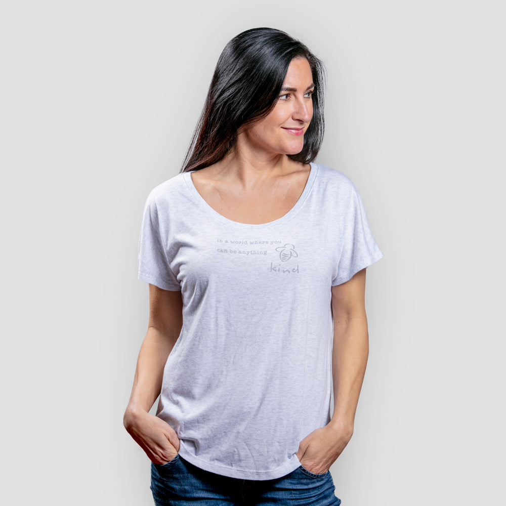 Bee Kind Quote Dolman -Heather White - BeeAttitudes In a world where you can be anything - be kind.  A quote for our times  - with a twist!  In today's atmosphere it is more important than ever to show compassion and kindness and what better way to remind yourself than with our signature bee!  Our super soft-dolman in a heather white drapes gently for a perfect fit on every body!  Our customers say this fits just right.  50% Polyester + 25% Cotton + 25% Rayon