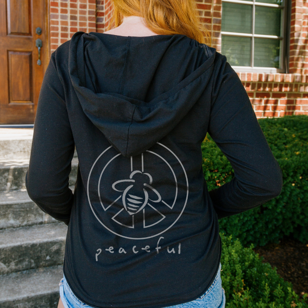 Bee Peaceful Beach Hoodie - BeeAttitudes Our Beach Hoodie isn't just for the beach!  It's quickly become our best-selling style and people are wearing it to the yoga studio, coffee shop, office, and just hanging out at home.  Your basic black with our logo bee on the front and a Bee Peaceful Graphic on the back goes with anything, including your smile!  Our customers say this runs true to size - perfect for those who like it a little short but not cropped. Graphic tees.