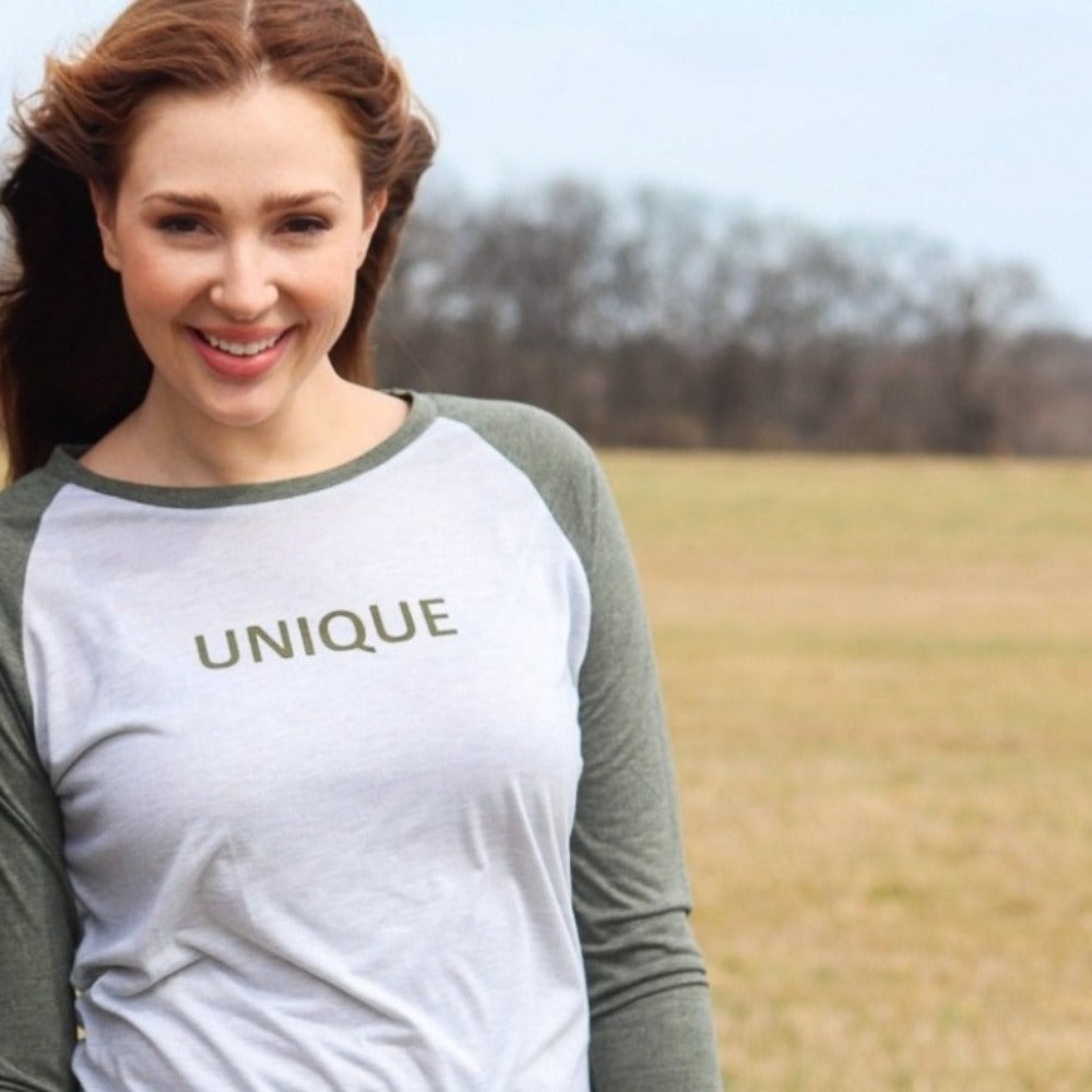 Unique Raglan - Heather Army Green/ Heather White - BeeAttitudes Be your own kind of beautiful!  Unique says it all - be you and be proud!  This might be the softest shirt you'll ever put on but it's bold in spirit! Graphic raglan shirt